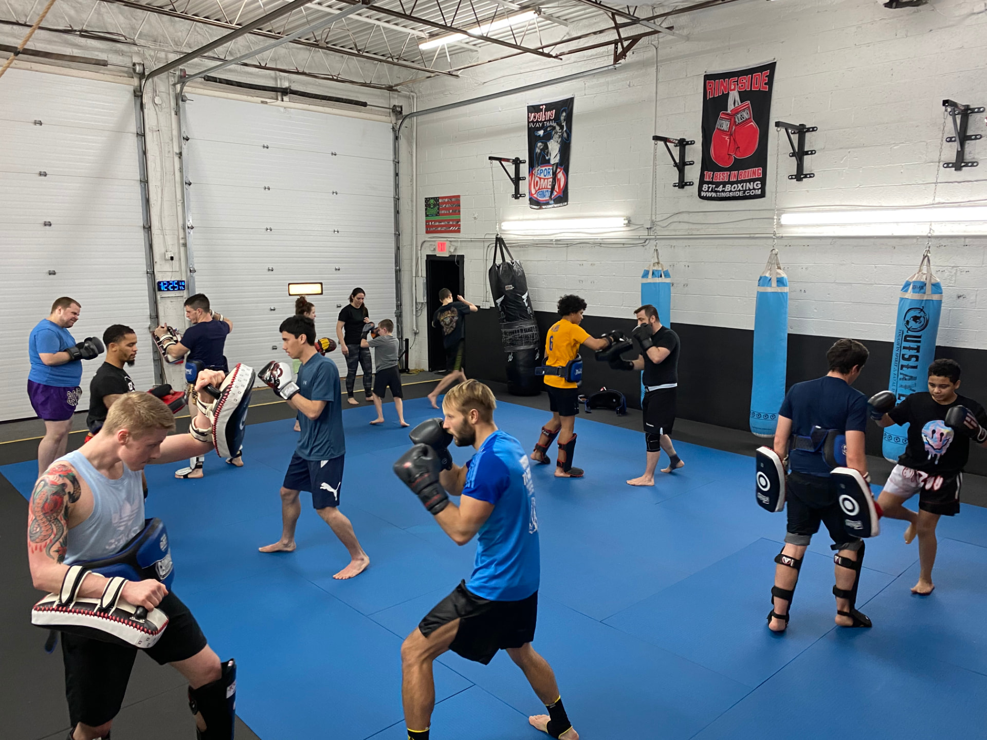 Pad work and heavy bag training in class